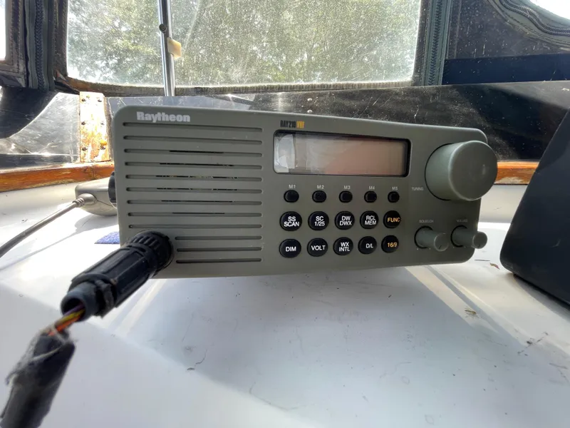 Slide: The Image of Raytheon marine radio on a 1982 Californian 34 LRC boat dashboard. - 22