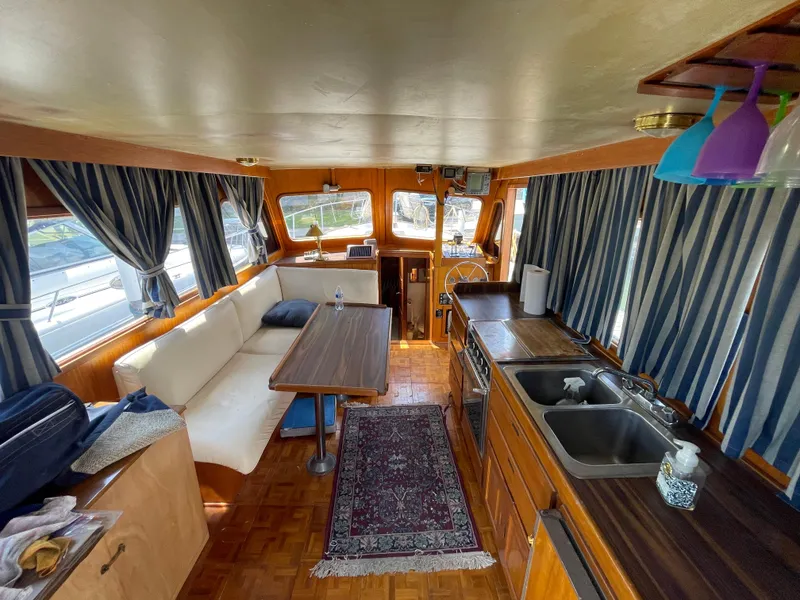 Slide: The Image of Interior of 1982 Californian 34 LRC yacht with kitchen and seating area. - 25