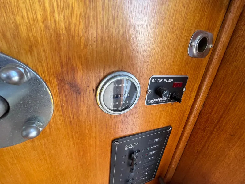Slide: The Image of Control panel of a 1982 Californian 34 LRC boat with bilge pump and hour meter. - 31