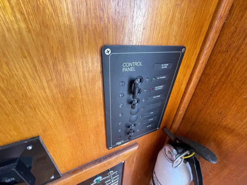 Slide: The Image of Control panel on 1982 Californian 34 LRC boat with fire extinguisher nearby. - 32