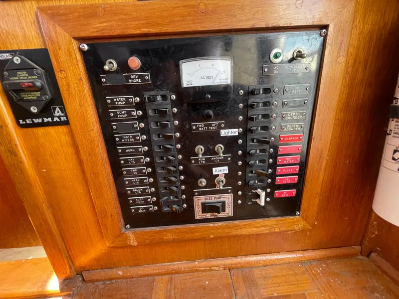 Slide: The Image of Electrical control panel on a 1982 Californian 34 LRC boat, featuring switches and gauges. - 33