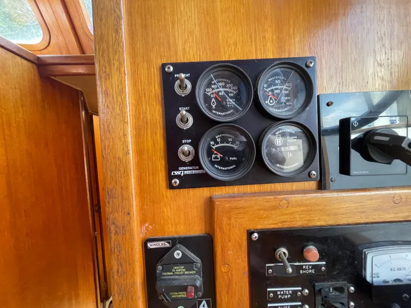 Slide: The Image of Control panel of a 1982 Californian 34 LRC boat with gauges and switches. - 34