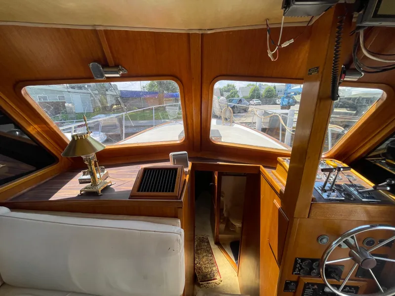 Slide: The Image of Interior of 1982 Californian 34 LRC yacht with wooden finish and steering wheel. - 36