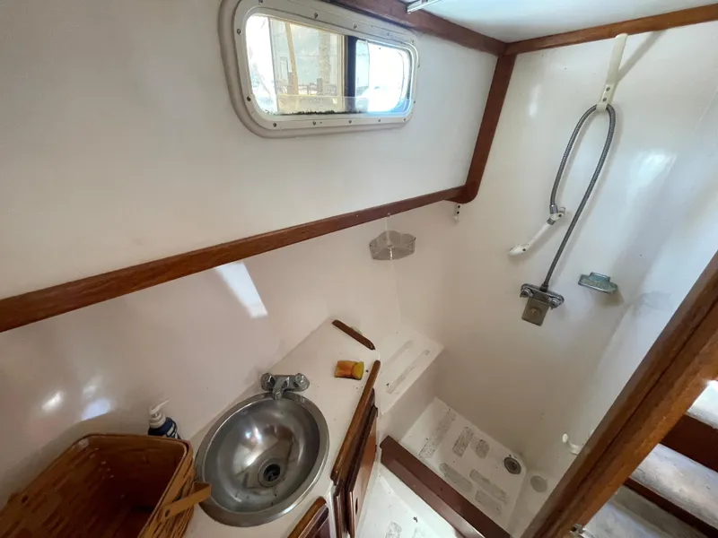 Slide: The Image of 1982 Californian 34 LRC yacht bathroom with sink, shower, and window. - 41