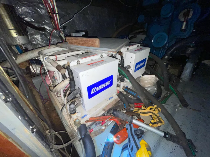 Slide: The Image of Engine room of 1982 Californian 34 LRC with Cruiseair units and tools. - 43