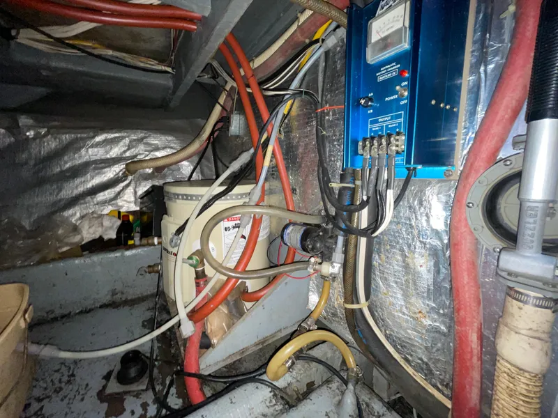 Slide: The Image of Electrical and plumbing systems inside a 1982 Californian 34 LRC boat. - 44