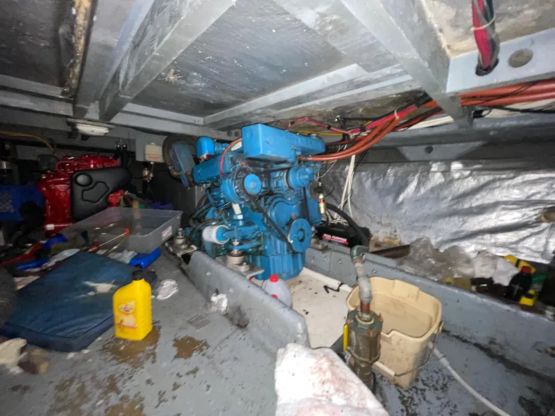 Slide: The Image of Engine room of 1982 Californian 34 LRC with visible machinery and tools. - 45