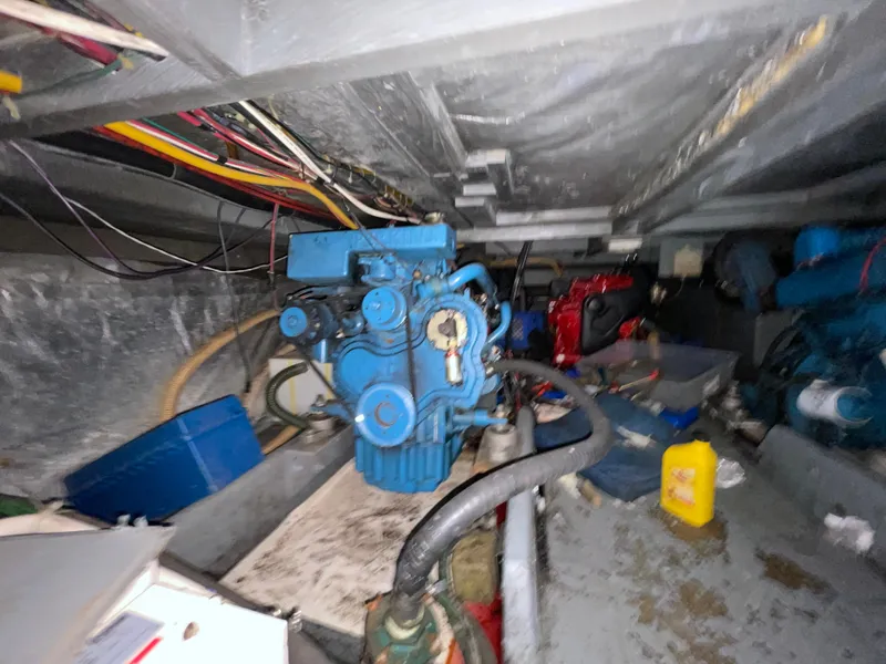 Slide: The Image of Engine room of 1982 Californian 34 LRC with visible wiring and machinery components. - 46