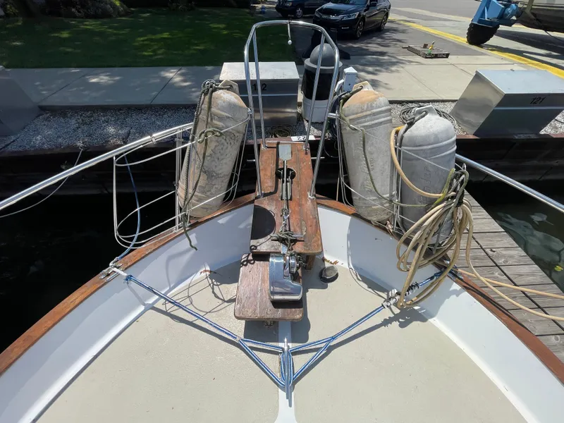 Slide: The Image of Bow of 1982 Californian 34 LRC yacht with anchor and docked at marina. - 8