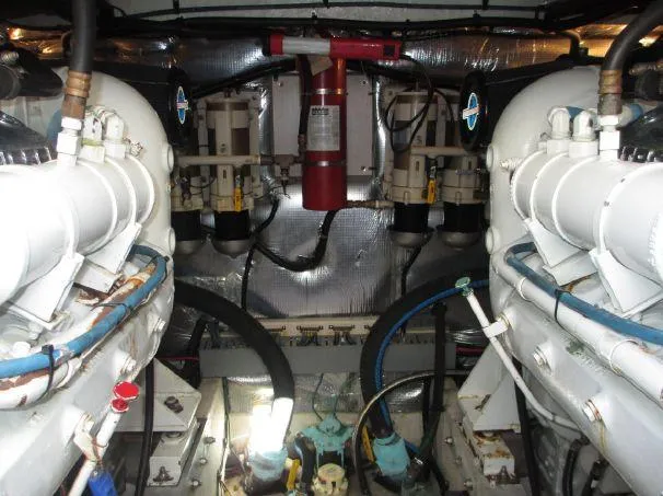 Slide: The Image of Engine room of a 1994 Sea Ray 500 Sundancer yacht, showcasing mechanical components. - 18