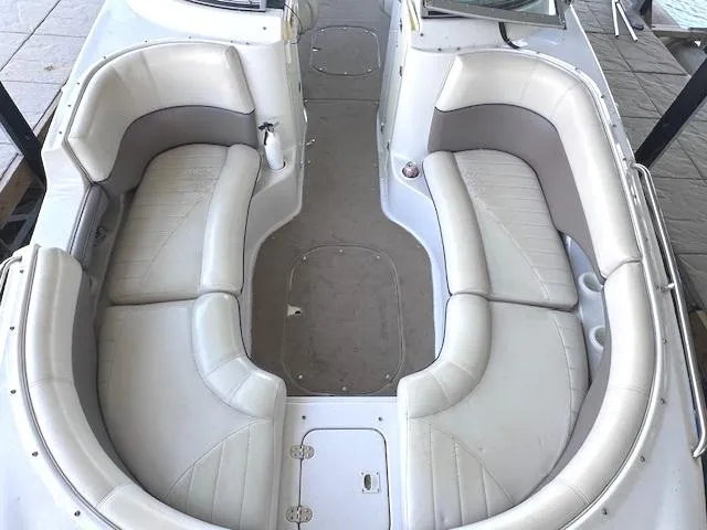 Slide: The Image of 2003 Four Winns 264 Funship boat interior with spacious white seating arrangement. - 10