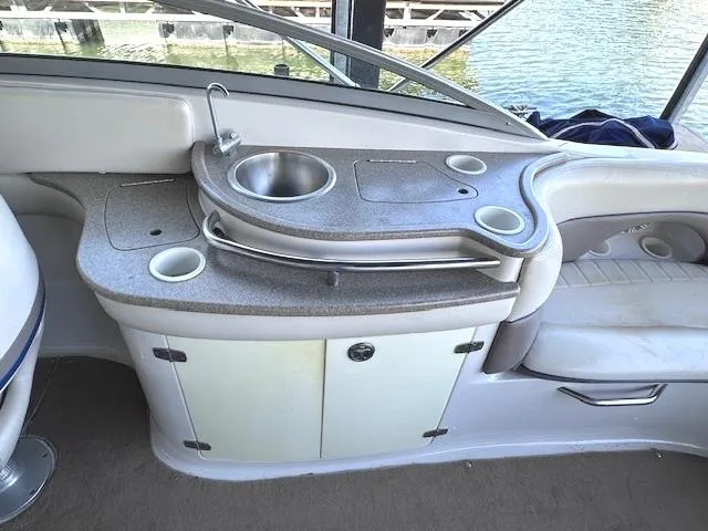 Slide: The Image of 2003 Four Winns 264 Funship boat interior with sink and seating area. - 11