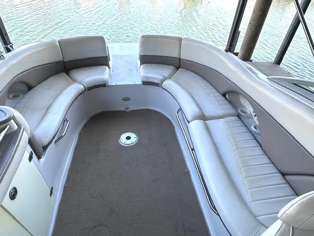 Slide: The Image of 2003 Four Winns 264 Funship boat interior with spacious seating and water view. - 12