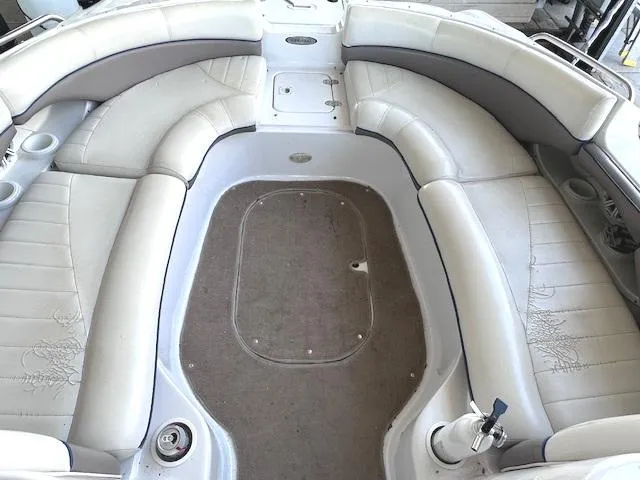 Slide: The Image of 2003 Four Winns 264 Funship boat interior with spacious seating and cup holders. - 13