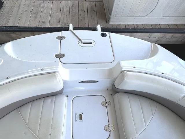 Slide: The Image of 2003 Four Winns 264 Funship boat interior with white seating and deck. - 14