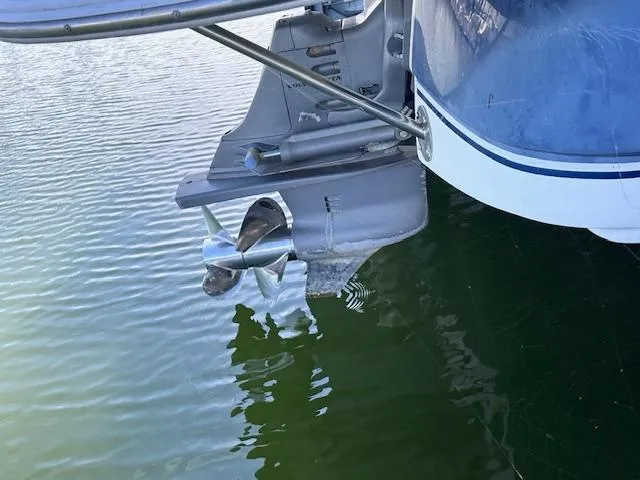 Slide: The Image of 2003 Four Winns 264 Funship boat propeller in water, close-up view. - 17