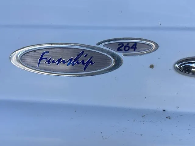 Slide: The Image of 2003 Four Winns 264 Funship logo on white surface, showcasing model branding. - 18