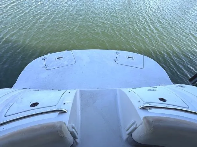 Slide: The Image of 2003 Four Winns 264 Funship boat deck overlooking calm water. - 19