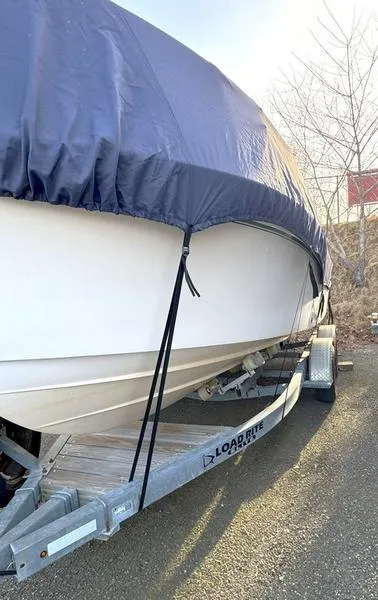 Slide: The Image of 2011 Grady-White 208 Adventure boat on Load Rite trailer, covered and parked outdoors. - 20