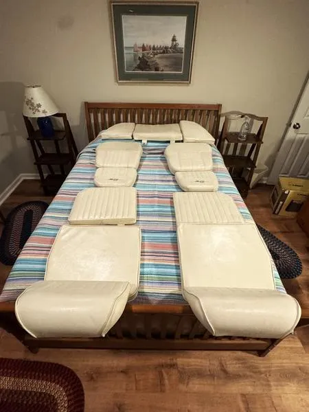 Slide: The Image of Cushions from a 2011 Grady-White 208 Adventure boat displayed on a bed. - 23