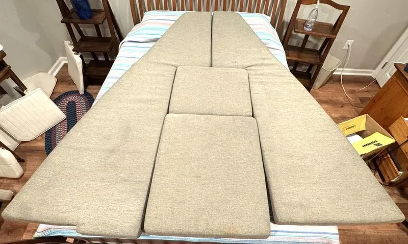 Slide: The Image of Cushions for 2011 Grady-White 208 Adventure boat, displayed on a bed in a room. - 24