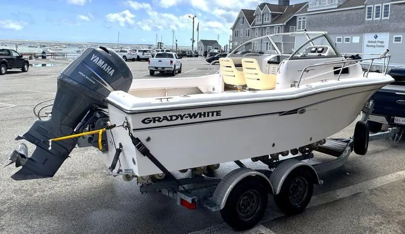 Slide: The Image of 2011 Grady-White 208 Adventure boat on trailer with Yamaha outboard motor at marina. - 25