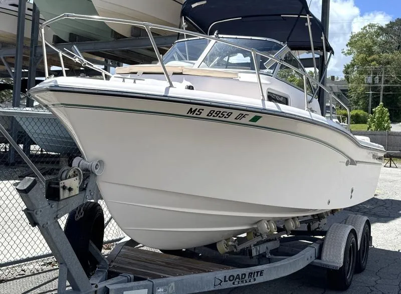 Slide: The Image of 2011 Grady-White 208 Adventure boat on trailer, parked outdoors. - 26