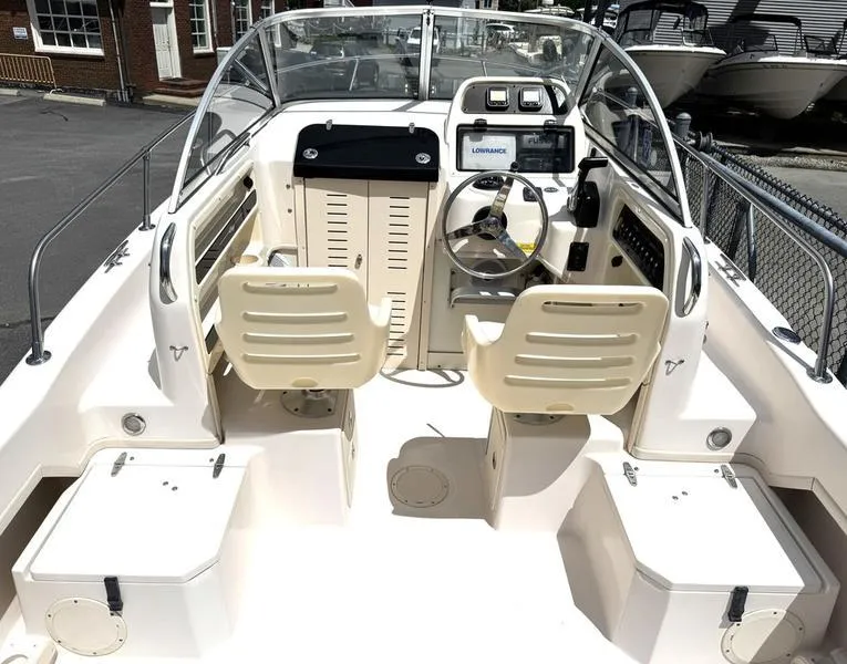 Slide: The Image of 2011 Grady-White 208 Adventure boat interior with dual seats and navigation equipment. - 28