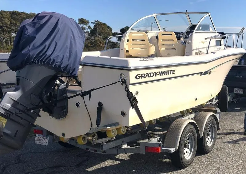 Slide: The Image of 2011 Grady-White 208 Adventure boat on trailer, parked outdoors. - 3