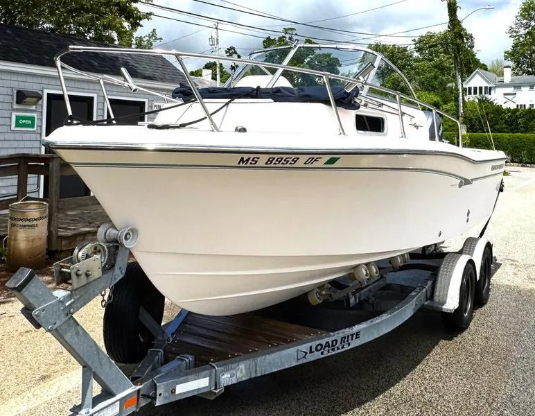 Slide: The Image of 2011 Grady-White 208 Adventure boat on trailer, parked outdoors. - 5