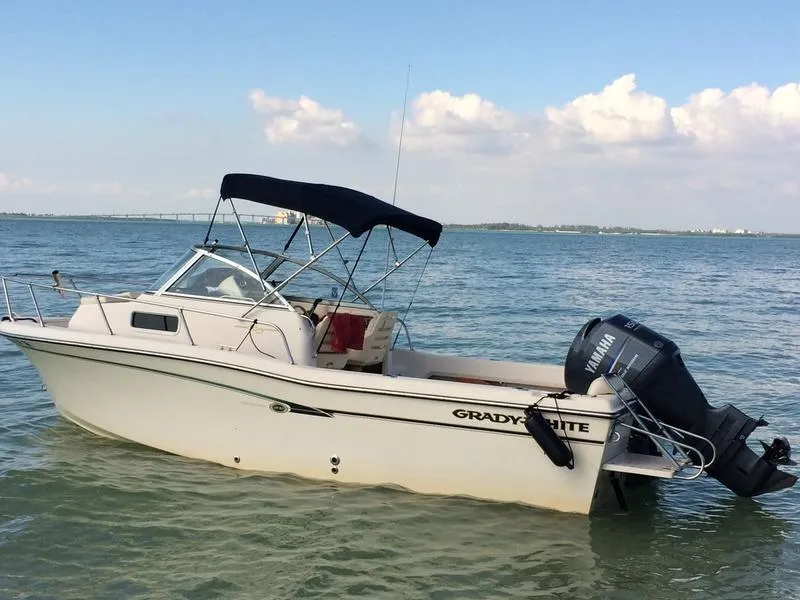 Slide: The Image of 2011 Grady-White 208 Adventure boat with Yamaha outboard on calm water. - 6