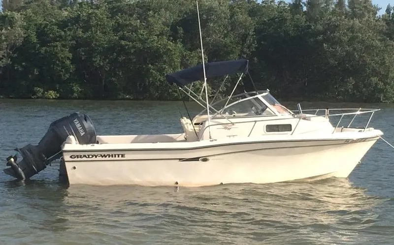 Slide: The Image of 2011 Grady-White 208 Adventure boat on water with Yamaha outboard motor. - 8