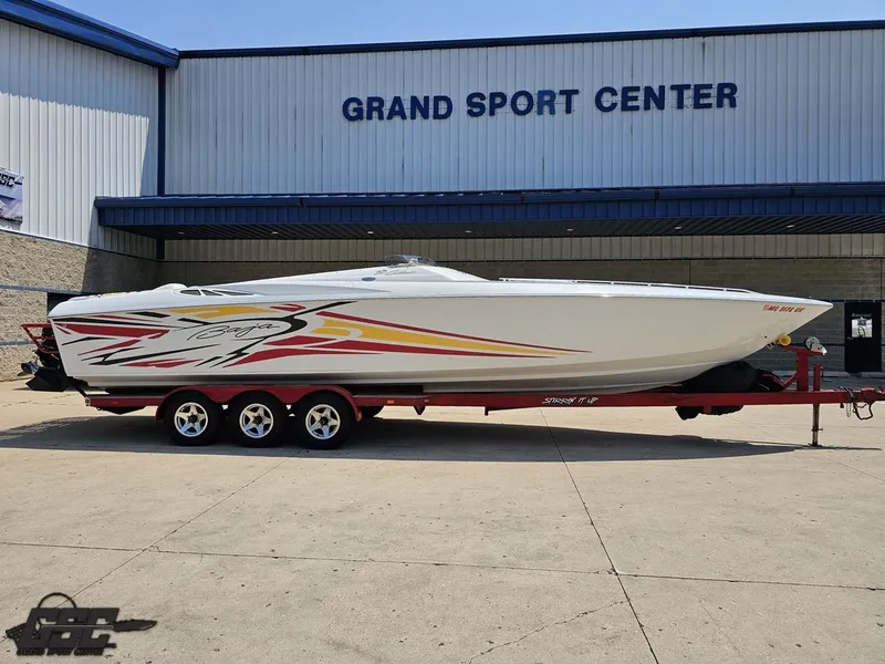 Slide: The Image of 2005 Baja 33 Outlaw boat on trailer at Grand Sport Center. - 13