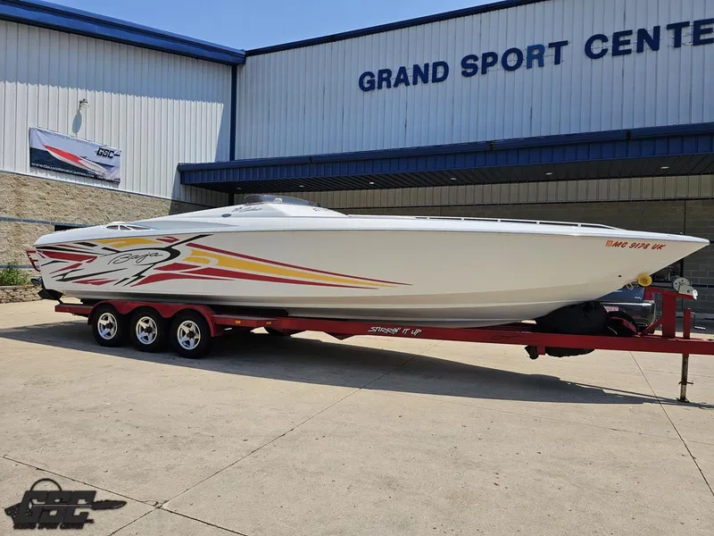 Slide: The Image of 2005 Baja 33 Outlaw boat on trailer at Grand Sport Center. - 14