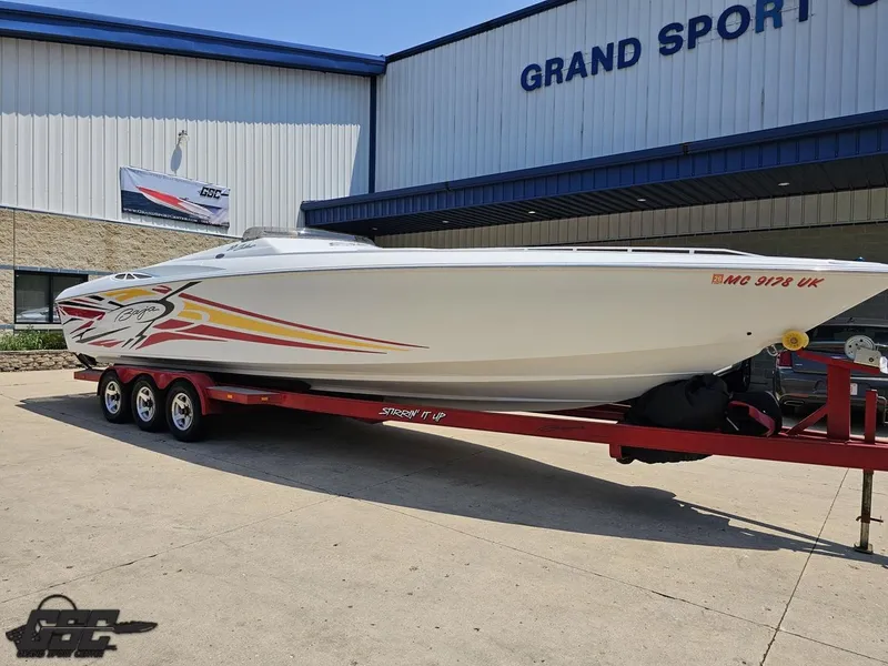 Slide: The Image of 2005 Baja 33 Outlaw speedboat on trailer outside Grand Sport Center. - 15