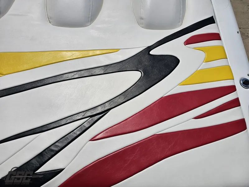 Slide: The Image of 2005 Baja 33 Outlaw boat seat with colorful abstract design in red, yellow, and black. - 45