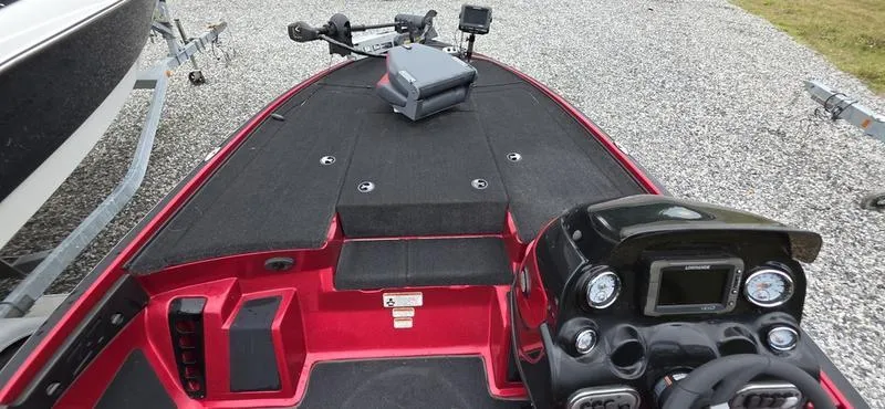 Slide: The Image of 2015 Nitro Z7 boat interior with steering console and fishing equipment. - 10