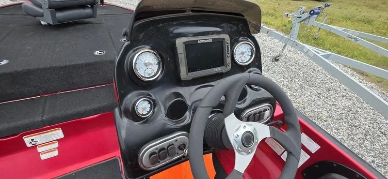 Slide: The Image of Dashboard of a 2015 Nitro Z7 boat with steering wheel and gauges. - 8