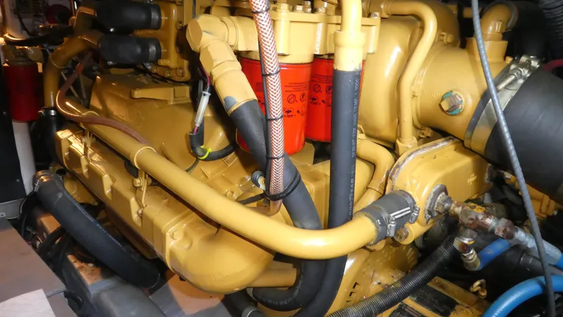 Slide: The Image of Engine of a 1995 Riviera Convertible, showcasing intricate mechanical components and hoses. - 32