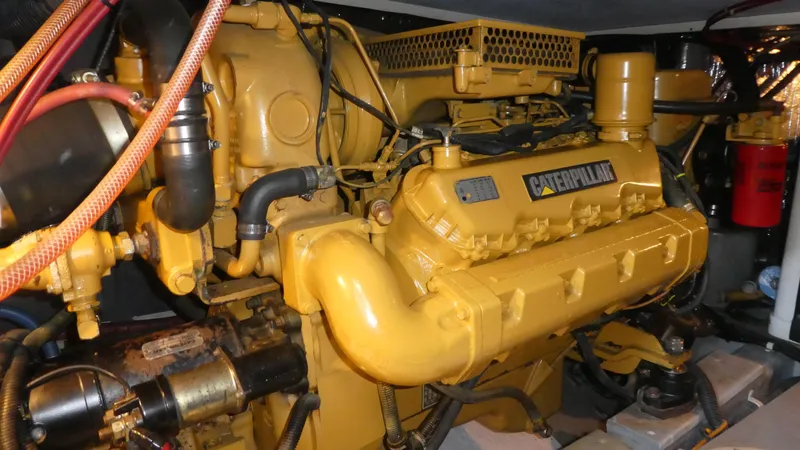 Slide: The Image of Caterpillar engine in a 1995 Riviera Convertible, showcasing detailed mechanical components. - 35