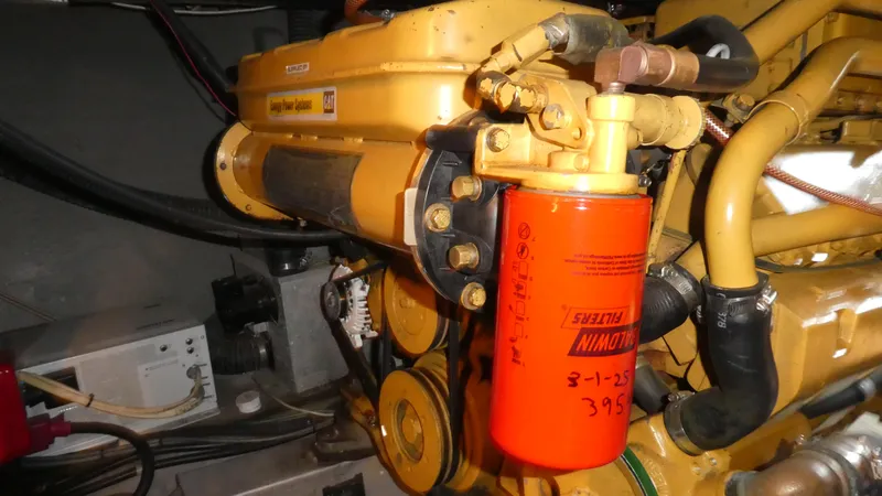 Slide: The Image of Engine compartment of a 1995 Riviera Convertible with CAT power system and Baldwin filter. - 37