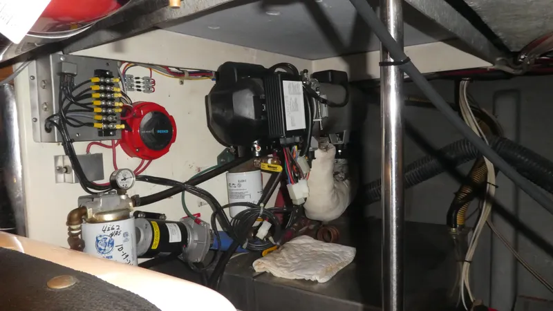 Slide: The Image of Engine compartment of a 1995 Riviera Convertible with wiring and mechanical components. - 39