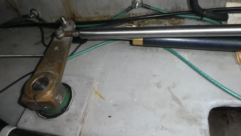 Slide: The Image of 1995 Riviera Convertible steering mechanism with hydraulic components and cables. - 45