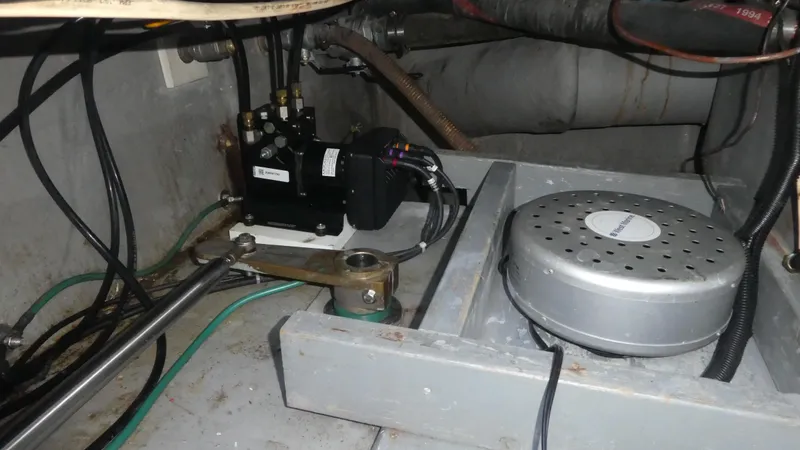 Slide: The Image of 1995 Riviera Convertible engine compartment with mechanical components and wiring. - 46