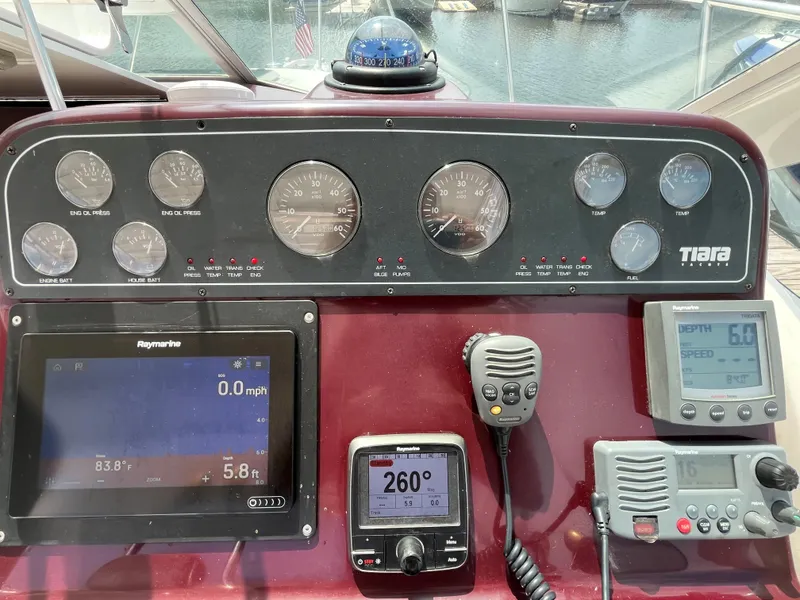Slide: The Image of Dashboard of a 2005 Tiara Yachts 2900 Coronet with navigation and communication instruments. - 14