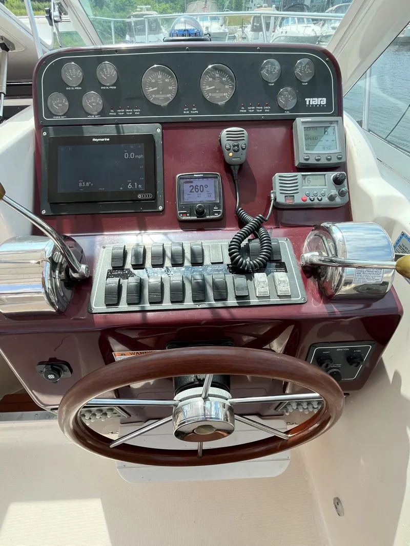 Slide: The Image of Helm of 2005 Tiara Yachts 2900 Coronet with navigation instruments and controls. - 15