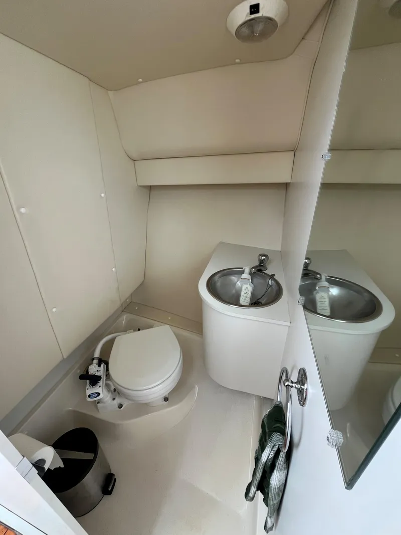 Slide: The Image of 2005 Tiara Yachts 2900 Coronet bathroom with toilet and sink. - 16