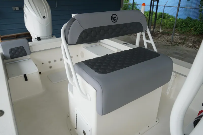 Slide: The Image of 2026 May-Craft 238 Center Console boat interior with cushioned seating and modern design. - 18