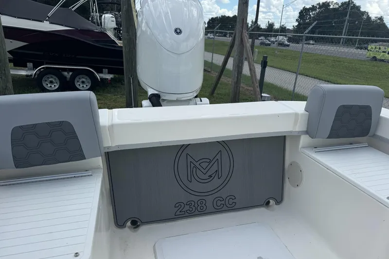 Slide: The Image of 2026 May-Craft 238 Center Console boat interior with seating and motor. - 19