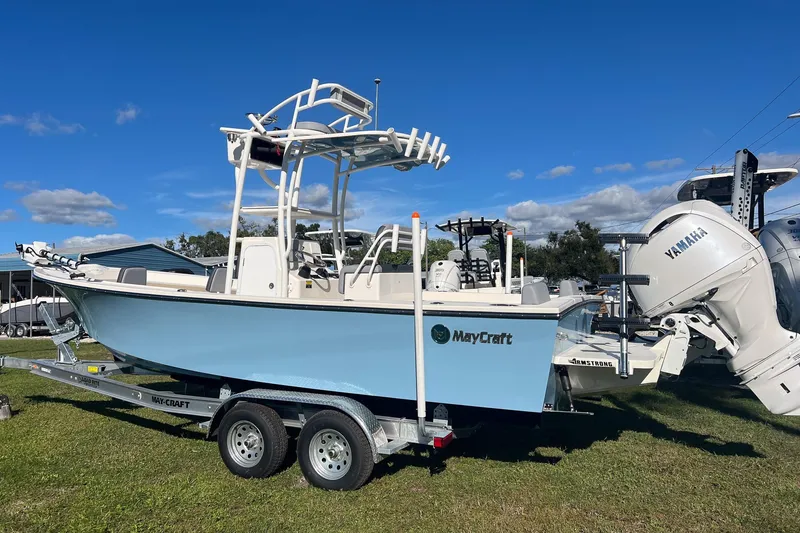 Slide: The Image of 2026 May-Craft 238 Center Console boat on trailer, featuring Yamaha outboard motor. - 2